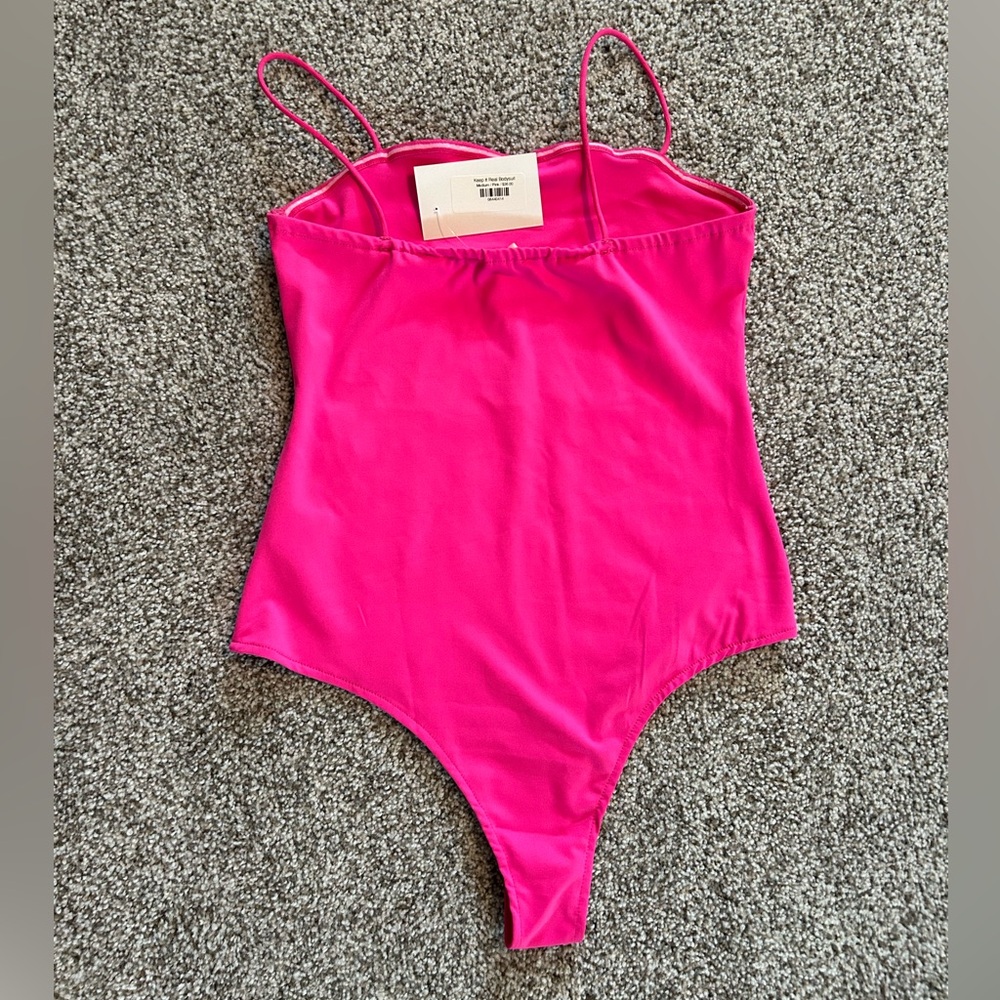 Pink body suit